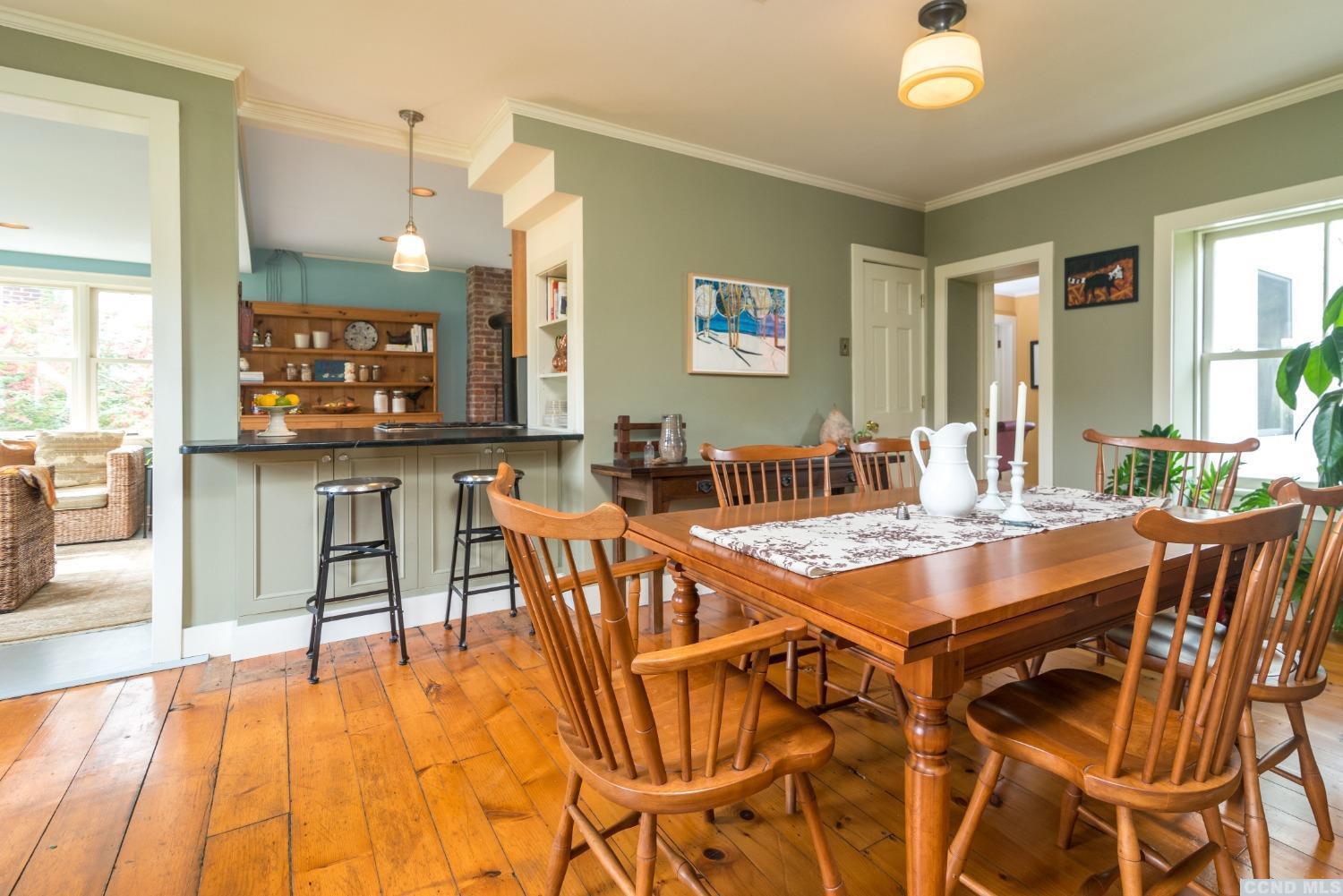 56 Beebe Pond Road Canaan, NY 12029 - Photo 12 of 50 a dining hall with stainless steel appliances a dining table and chairs with wooden floor
