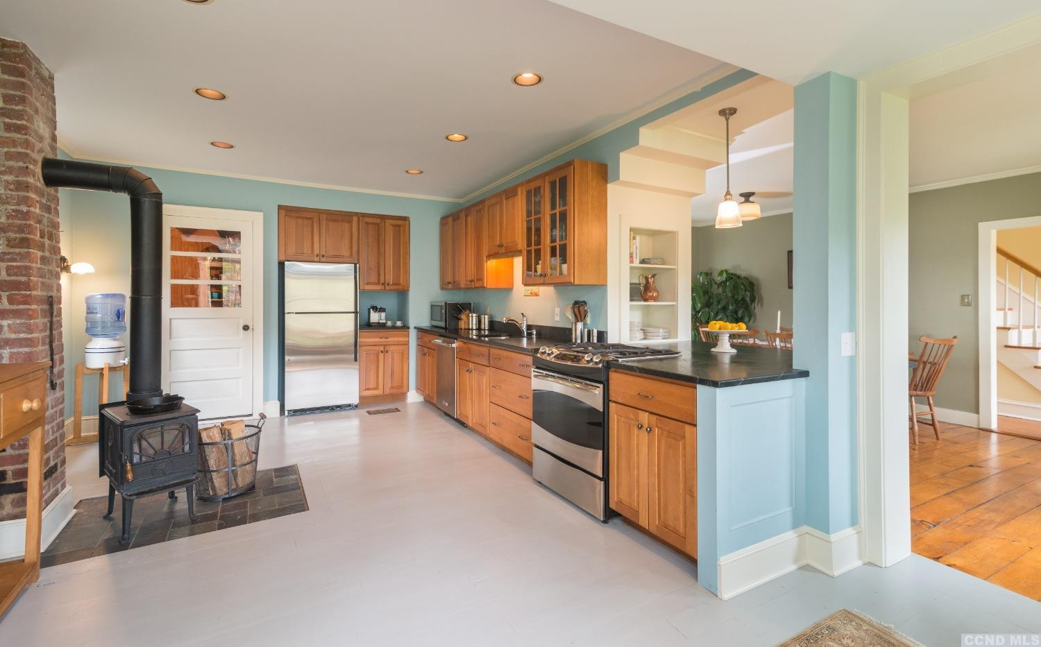 56 Beebe Pond Road Canaan, NY 12029 - Photo 14 of 50 a large kitchen with stainless steel appliances granite countertop a refrigerator and a stove top oven