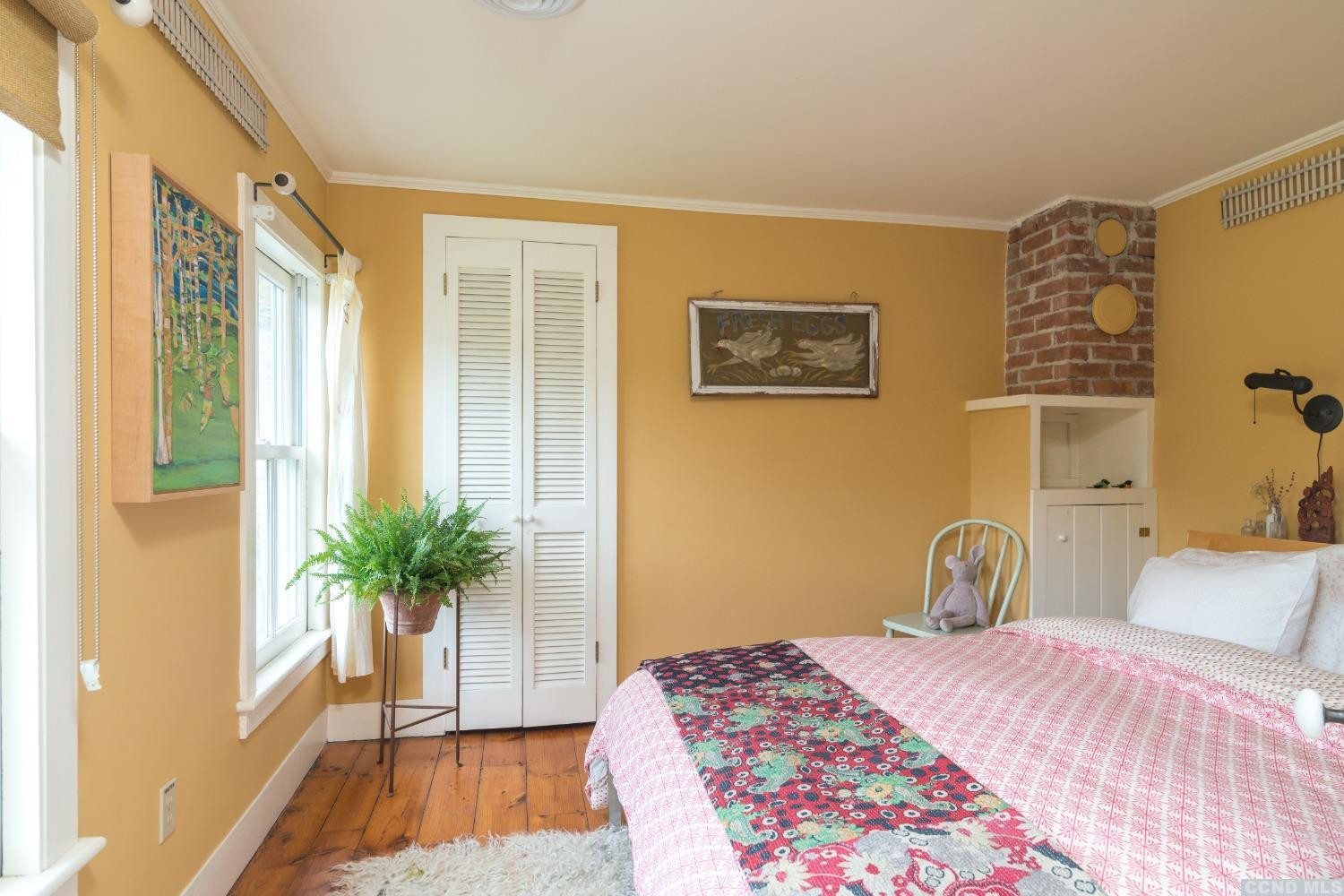 56 Beebe Pond Road Canaan, NY 12029 - Photo 18 of 50 a bedroom with a bed and a large window with wooden floor