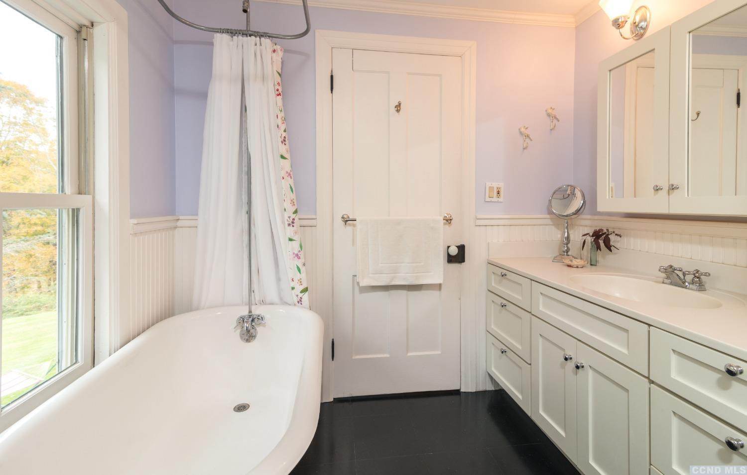 56 Beebe Pond Road Canaan, NY 12029 - Photo 20 of 50 a bathroom with a tub sink and mirror