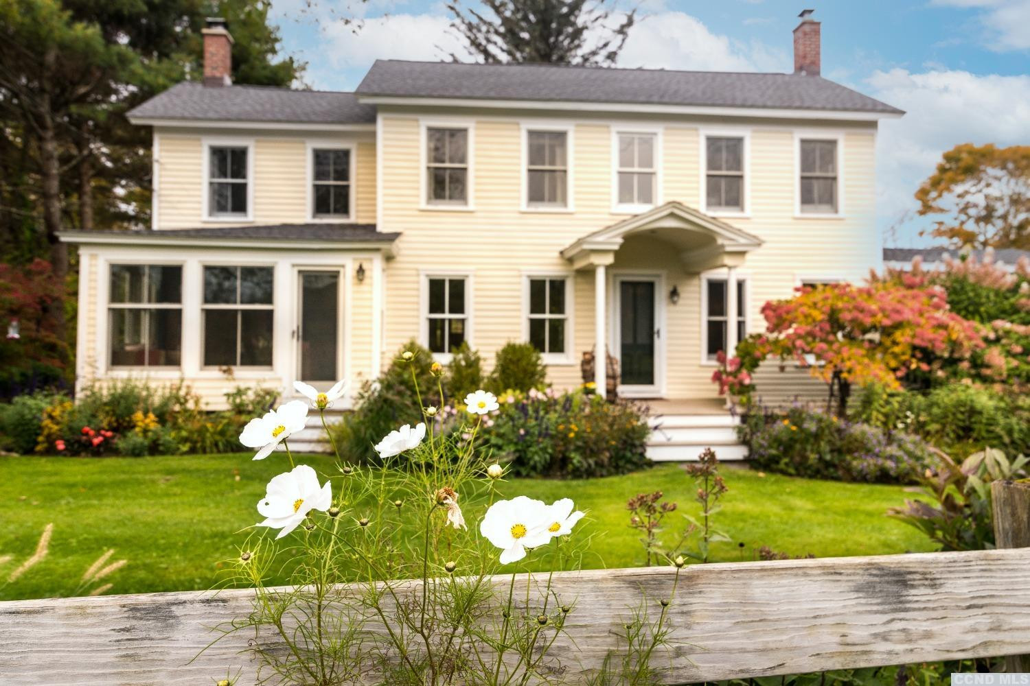 56 Beebe Pond Road Canaan, NY 12029 - Photo 31 of 50 a front view of a house with a garden