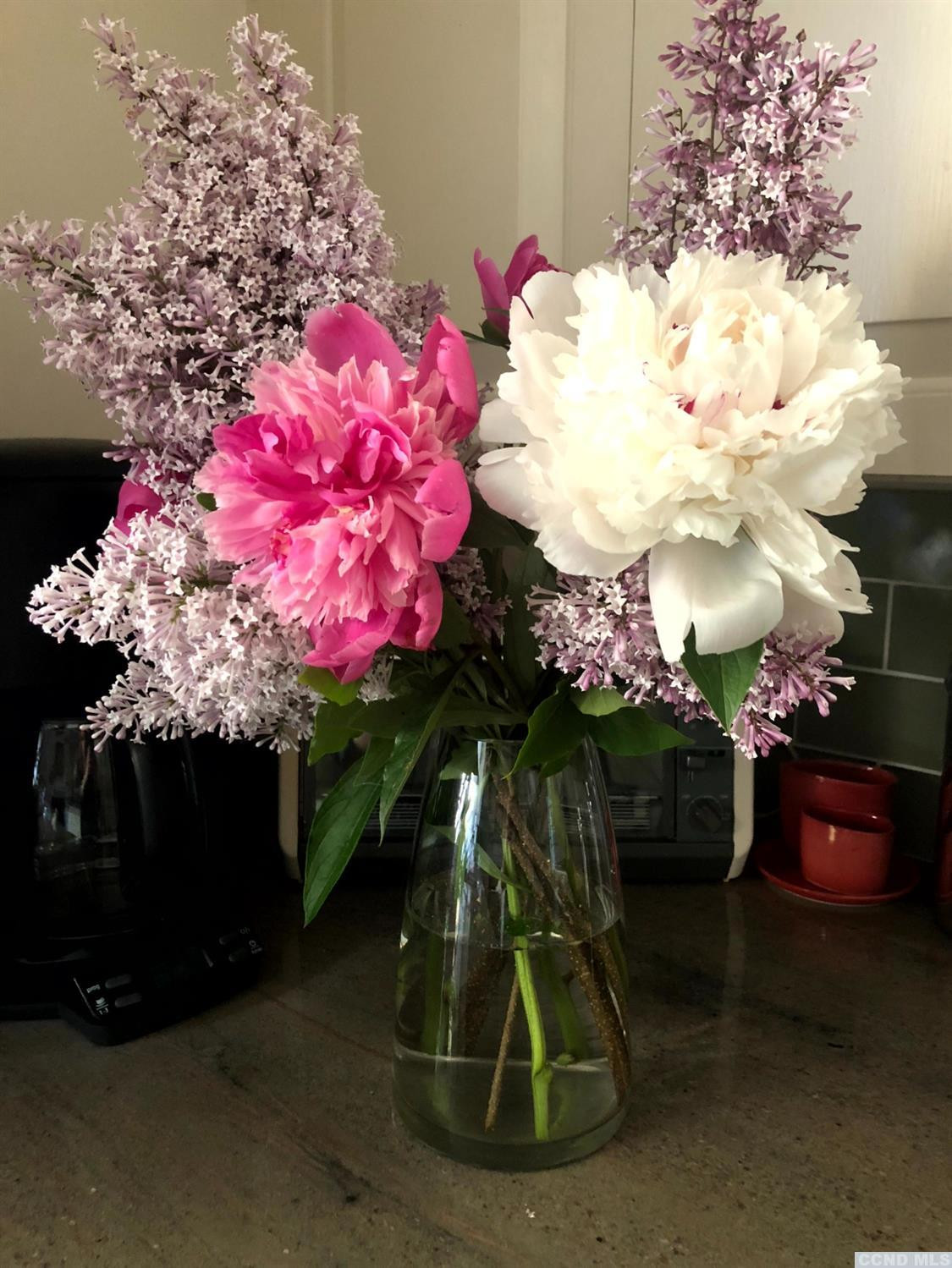 56 Beebe Pond Road Canaan, NY 12029 - Photo 40 of 50 a vase of flowers sitting on a table