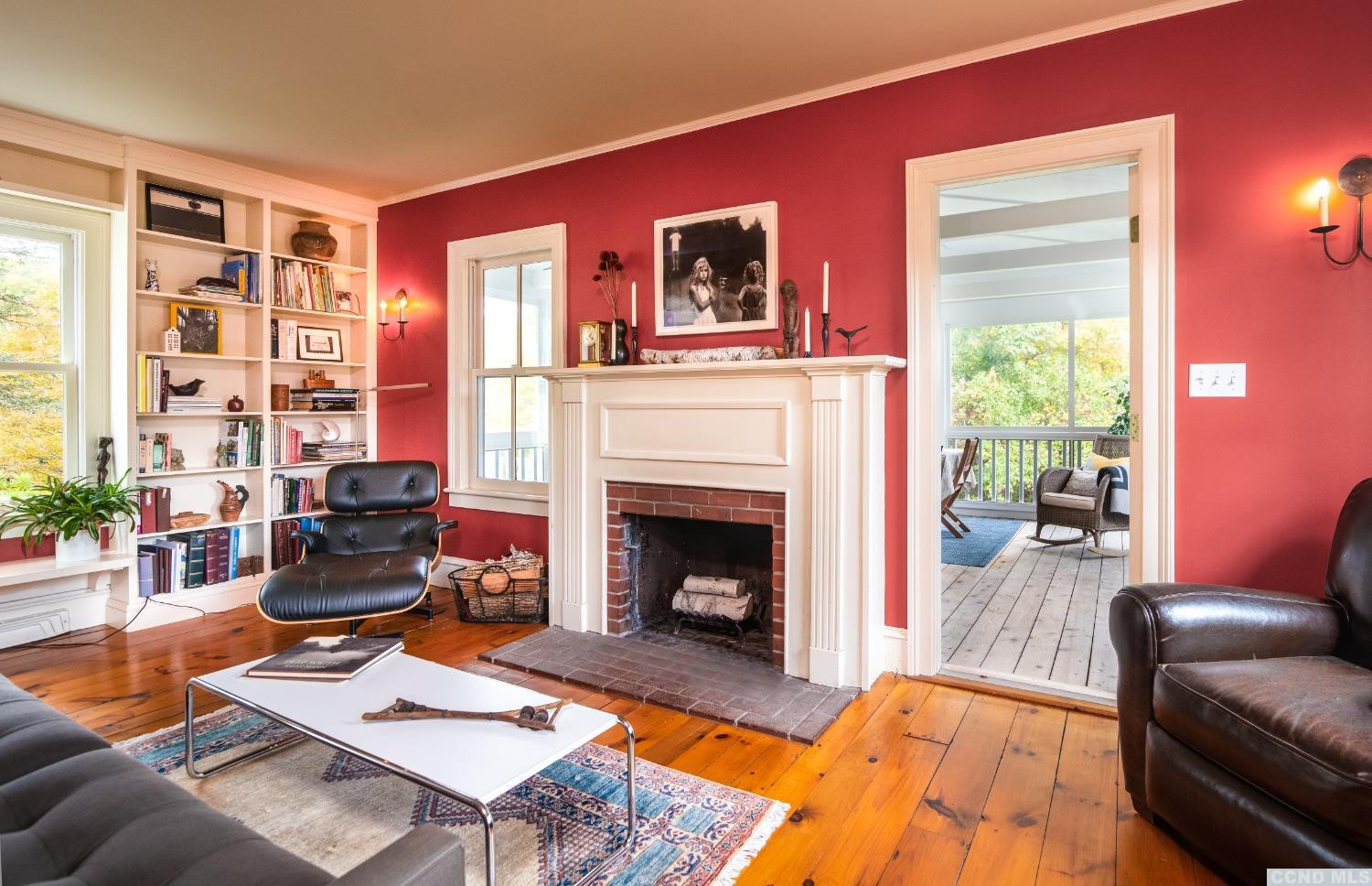 56 Beebe Pond Road Canaan, NY 12029 - Photo 7 of 50 a living room with furniture fireplace and a large window