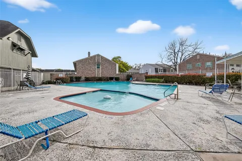 an aerial view of a house with a swimming pool