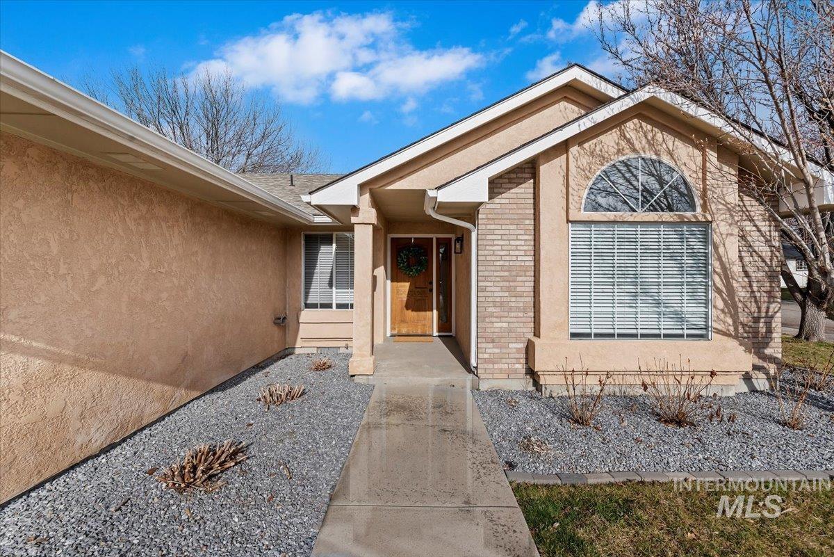 1528 East Peridot Street Meridian, ID 83646 - Photo 3 of 28 Entrance to property with brick siding and stucco siding