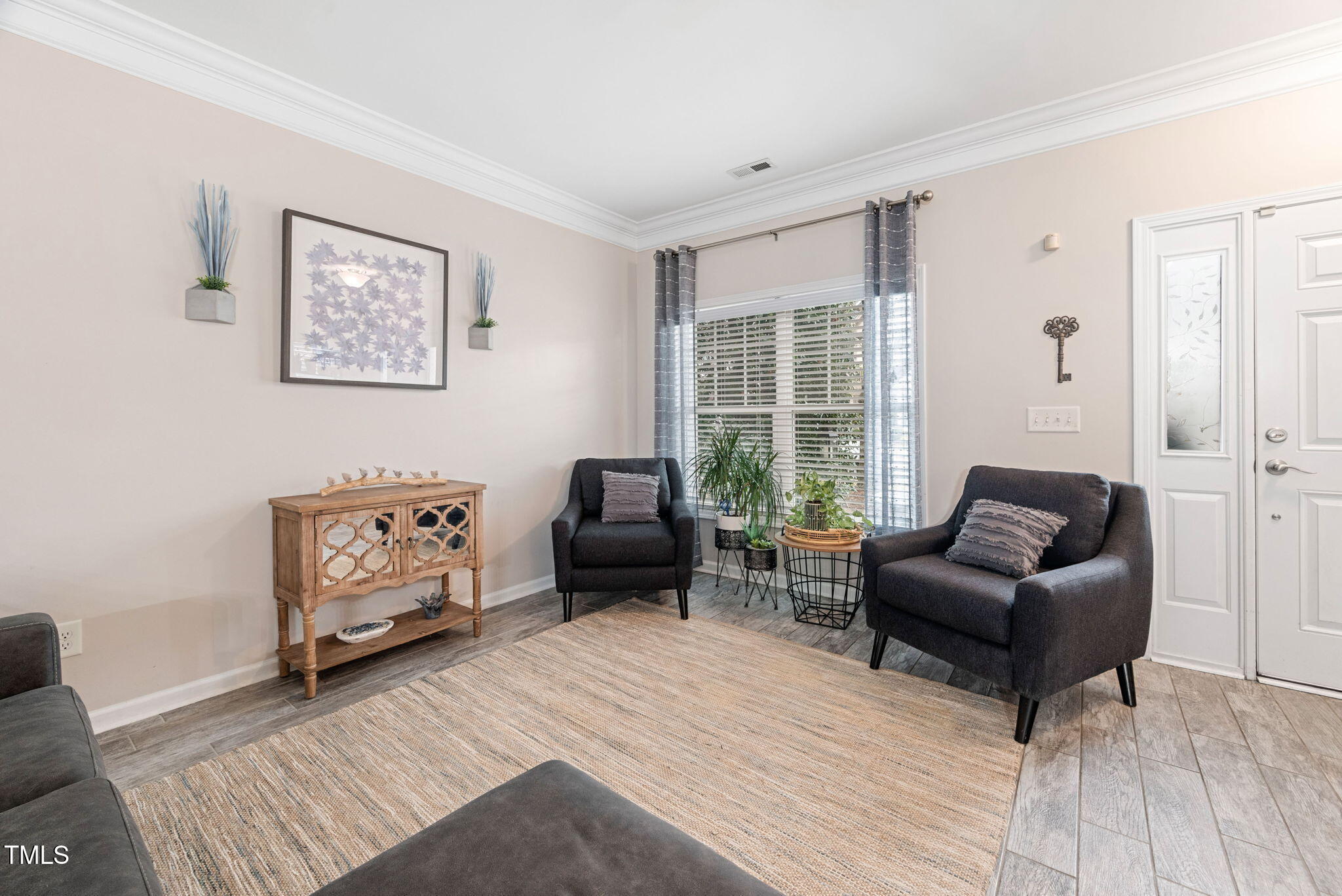 992 Ambergate Apex, NC 27502 - Photo 7 of 39 a living room with furniture and a window