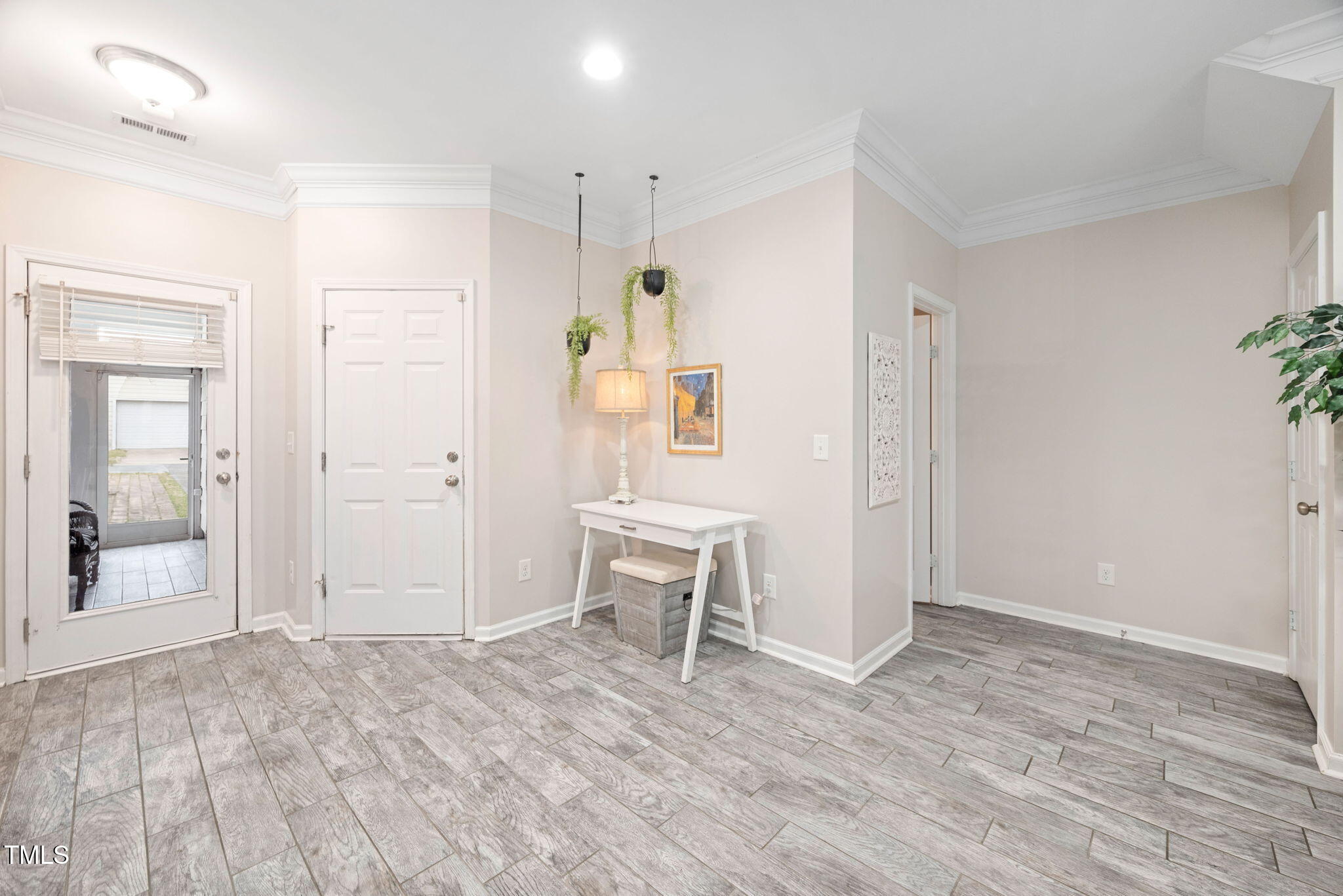 992 Ambergate Apex, NC 27502 - Photo 13 of 39 an empty room with wooden floor and windows