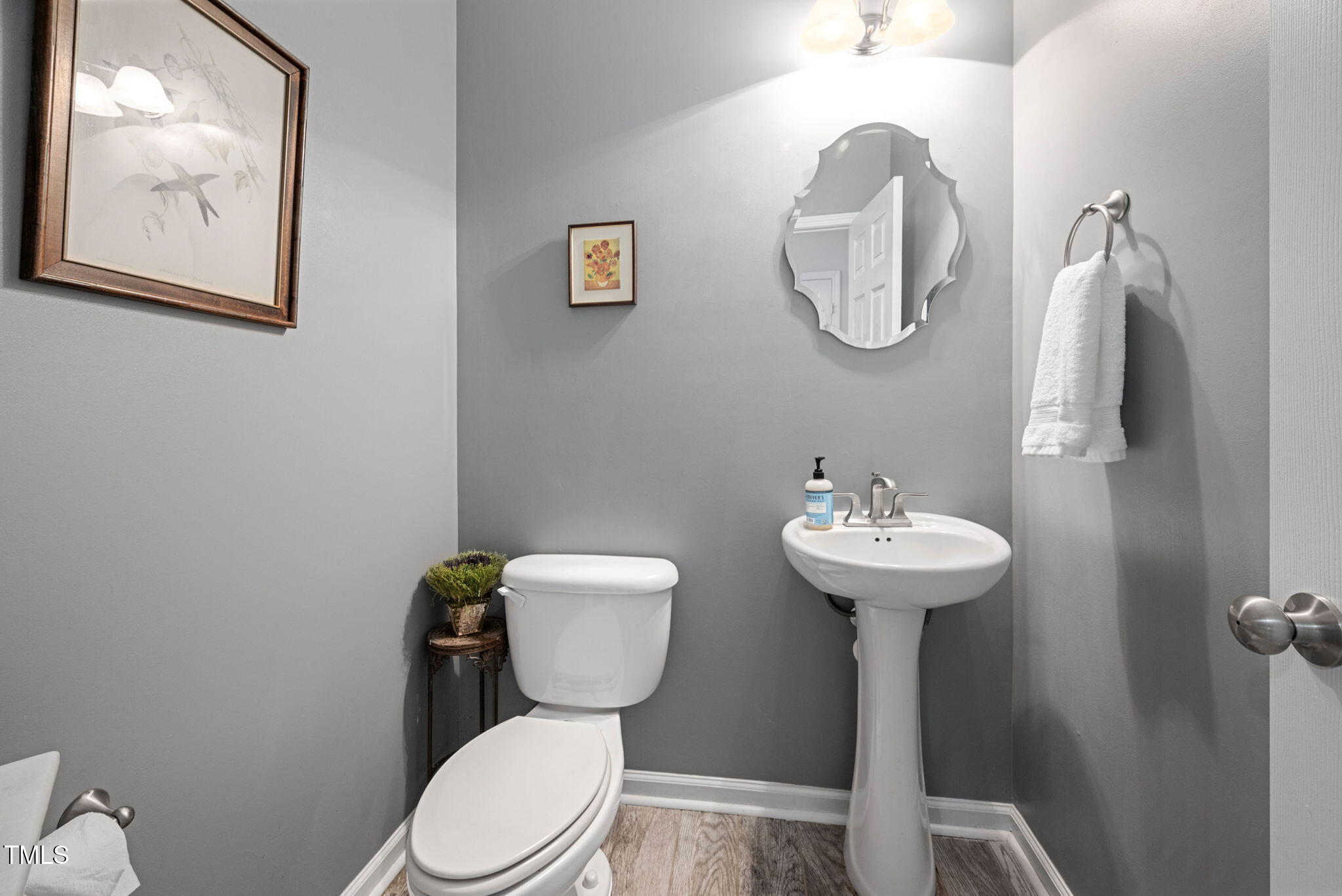 992 Ambergate Apex, NC 27502 - Photo 14 of 39 a bathroom with a toilet sink and mirror