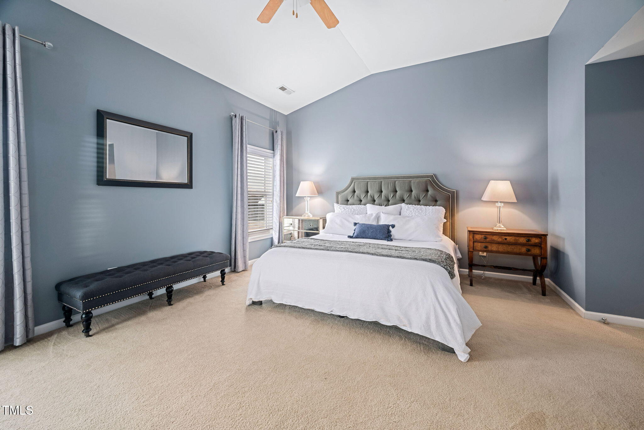 992 Ambergate Apex, NC 27502 - Photo 16 of 39 a bedroom with bed and a night stand