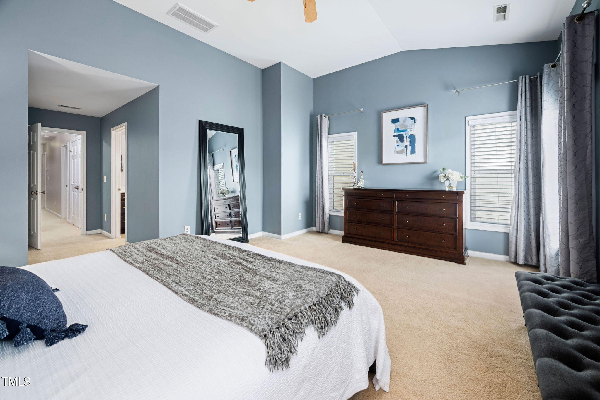 992 Ambergate Apex, NC 27502 - Photo 17 of 39 a bedroom with a bed and a dresser