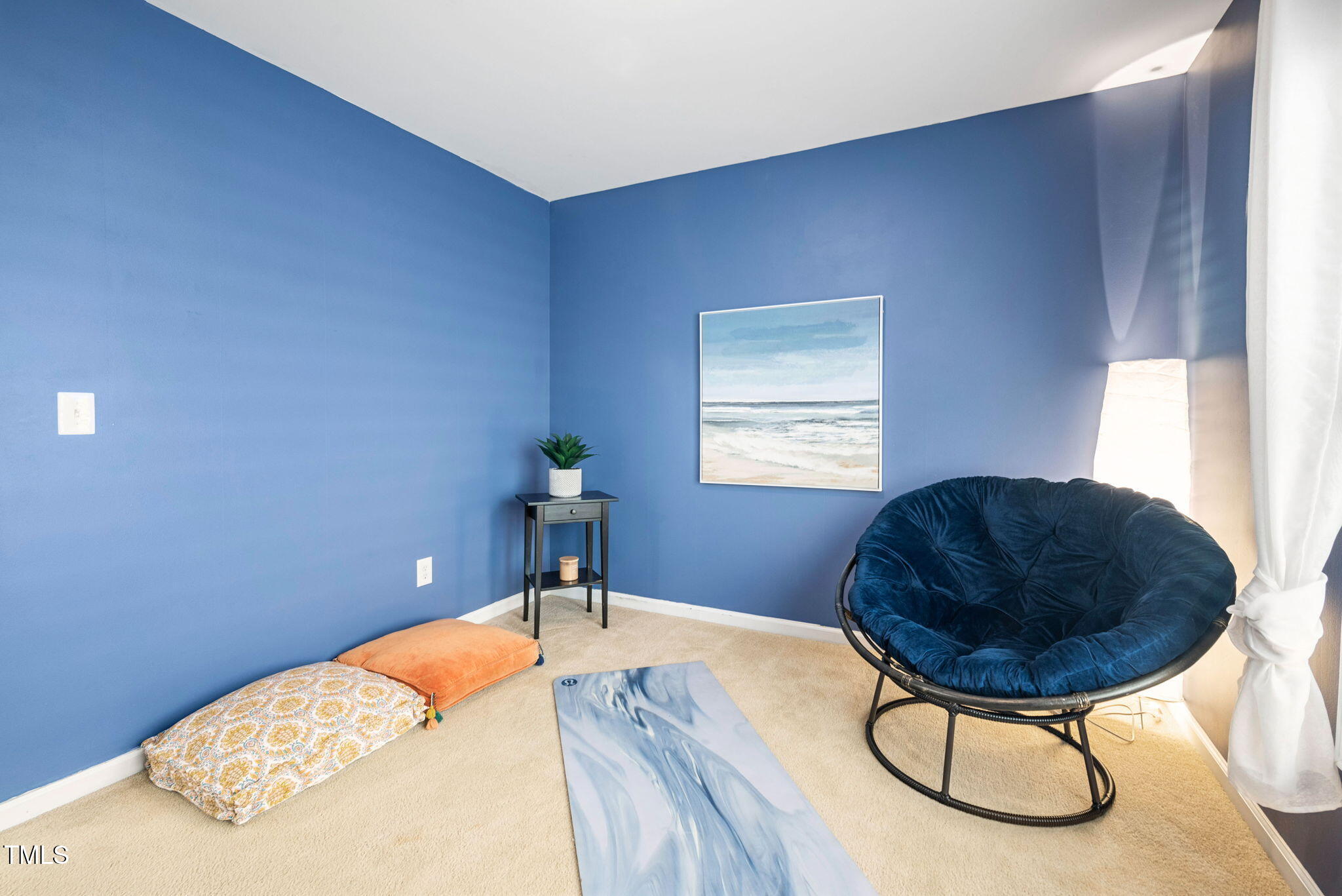 992 Ambergate Apex, NC 27502 - Photo 20 of 39 a bedroom with a bed and a chandelier