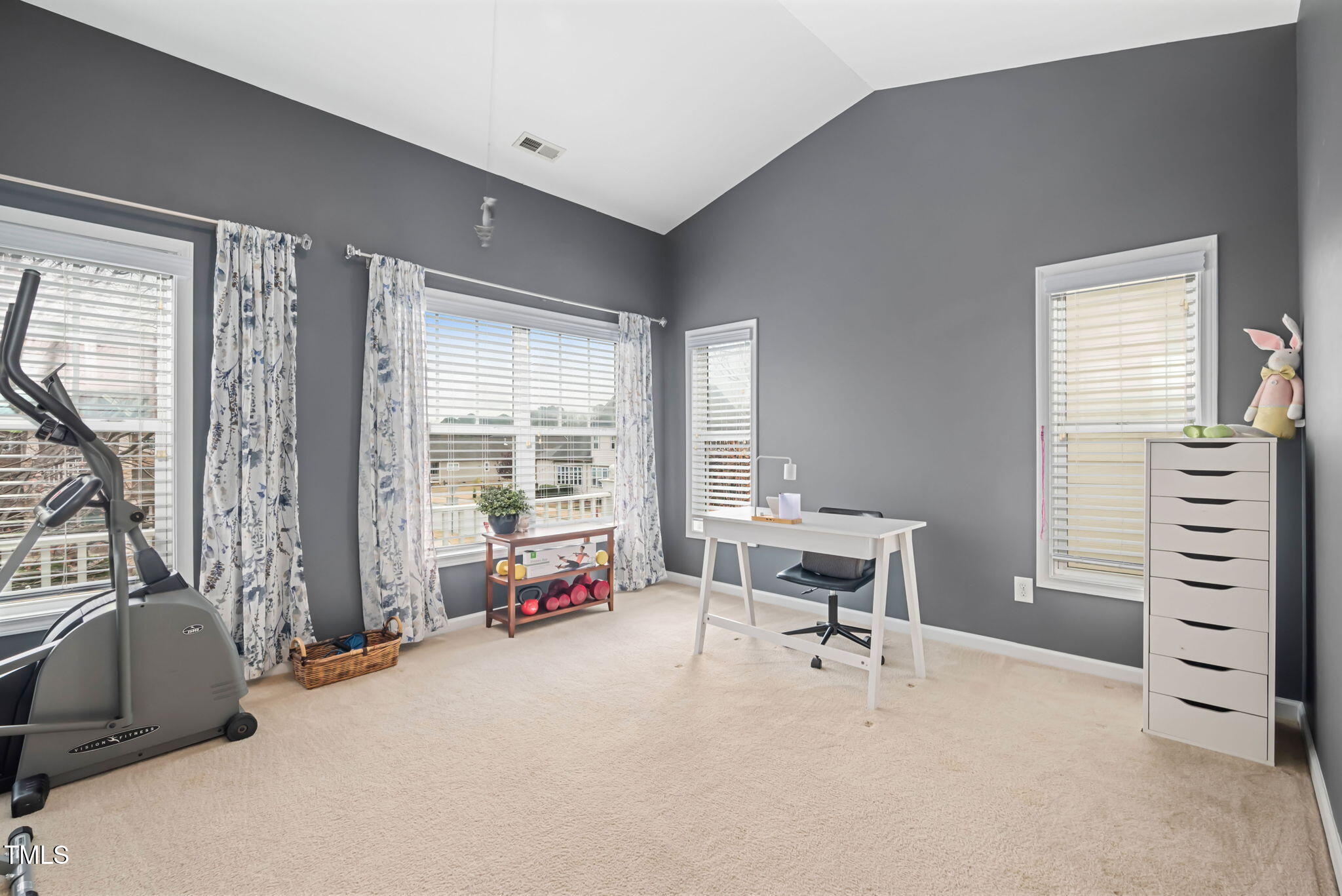 992 Ambergate Apex, NC 27502 - Photo 23 of 39 a bedroom with furniture and a large window