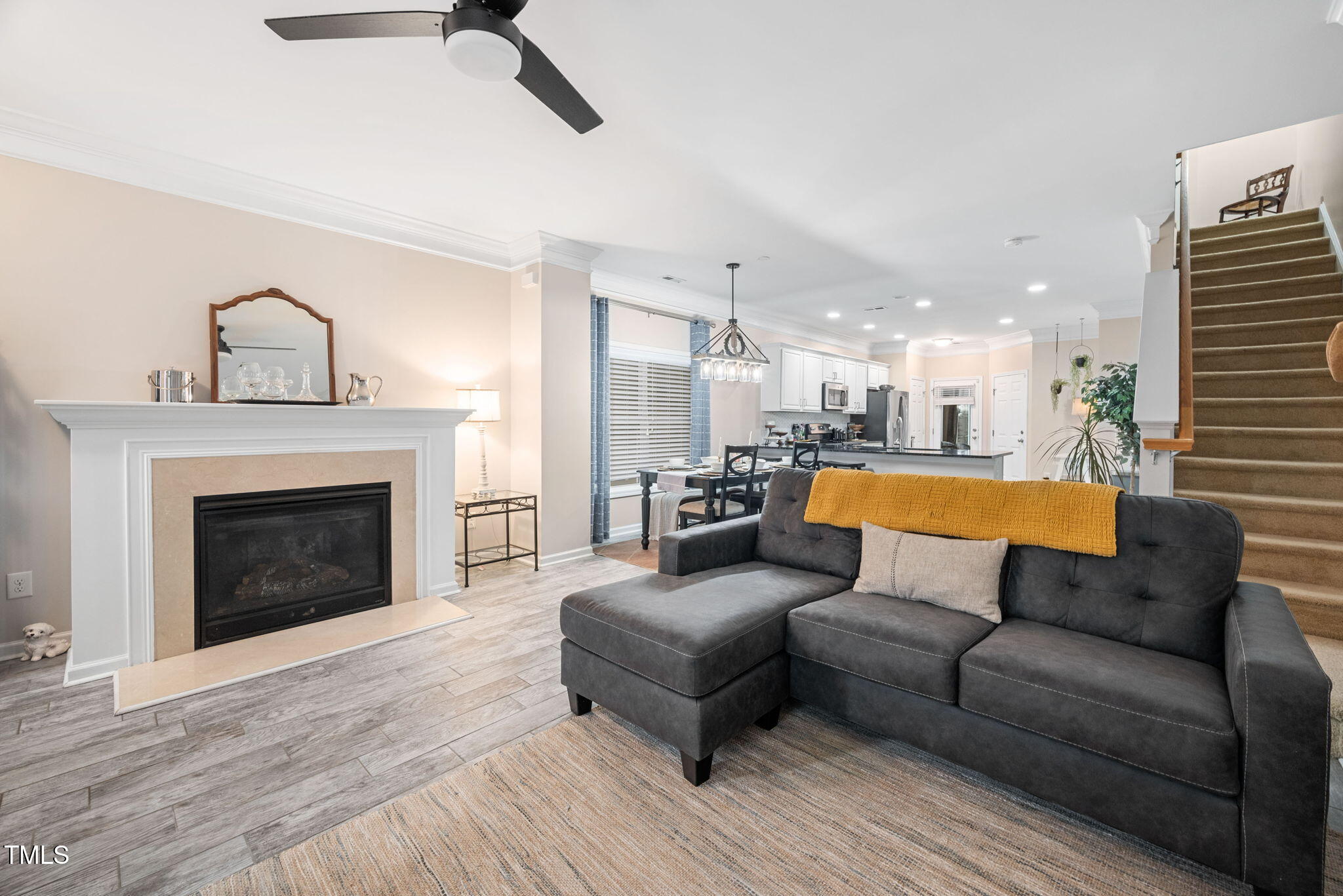 992 Ambergate Apex, NC 27502 - Photo 4 of 39 a living room with furniture and a fireplace