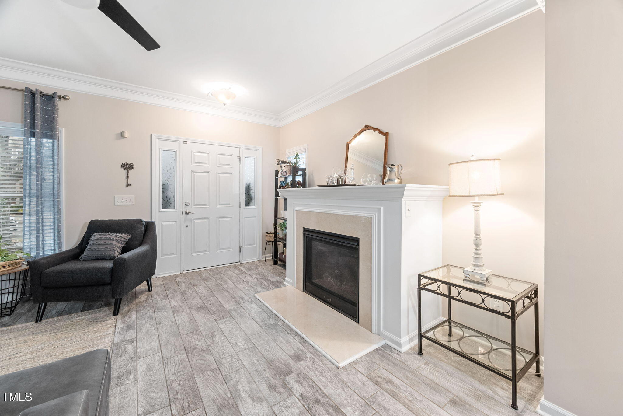 992 Ambergate Apex, NC 27502 - Photo 5 of 39 a living room with furniture and a fireplace
