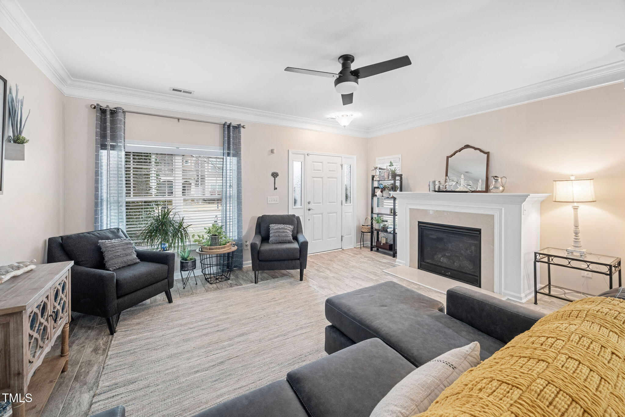 992 Ambergate Apex, NC 27502 - Photo 6 of 39 a living room with furniture and a fireplace