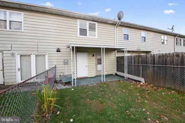 a front view of house with an outdoor space