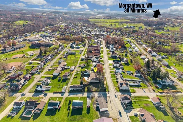 an aerial view of residential houses with outdoor space