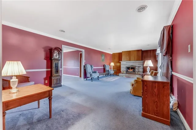 a reading room with furniture and a lamp