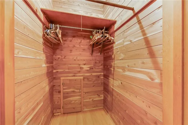 a view of a livingroom with a ceiling fan and window