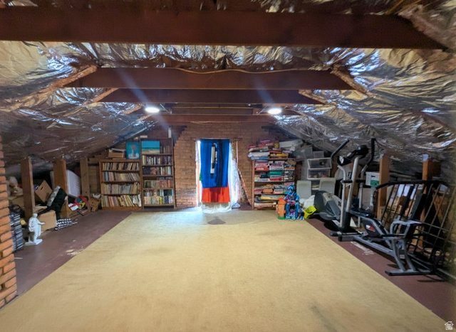 190 North 200 E Street Beaver, UT 84713 - Photo 39 of 40 Expansive attic space featuring exposed wood beams, reflective insulation, and recessed lighting