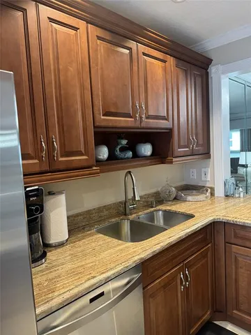 a kitchen with a sink and cabinets