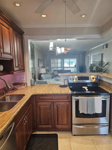 a kitchen with a stove and a sink