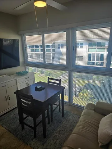 a view of a dining room with furniture window and outside view