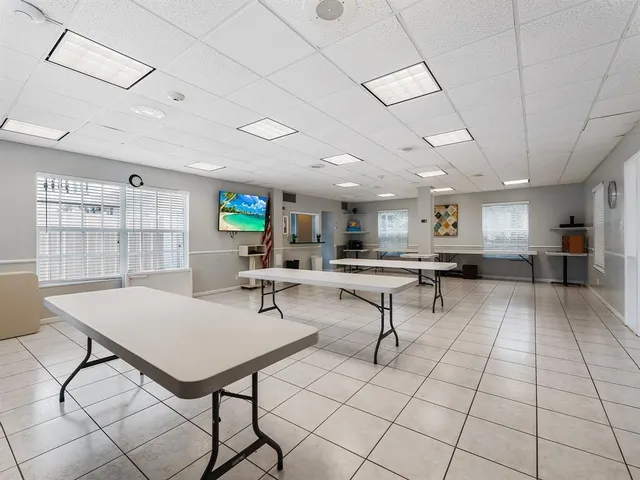 a living room with furniture a table and chairs