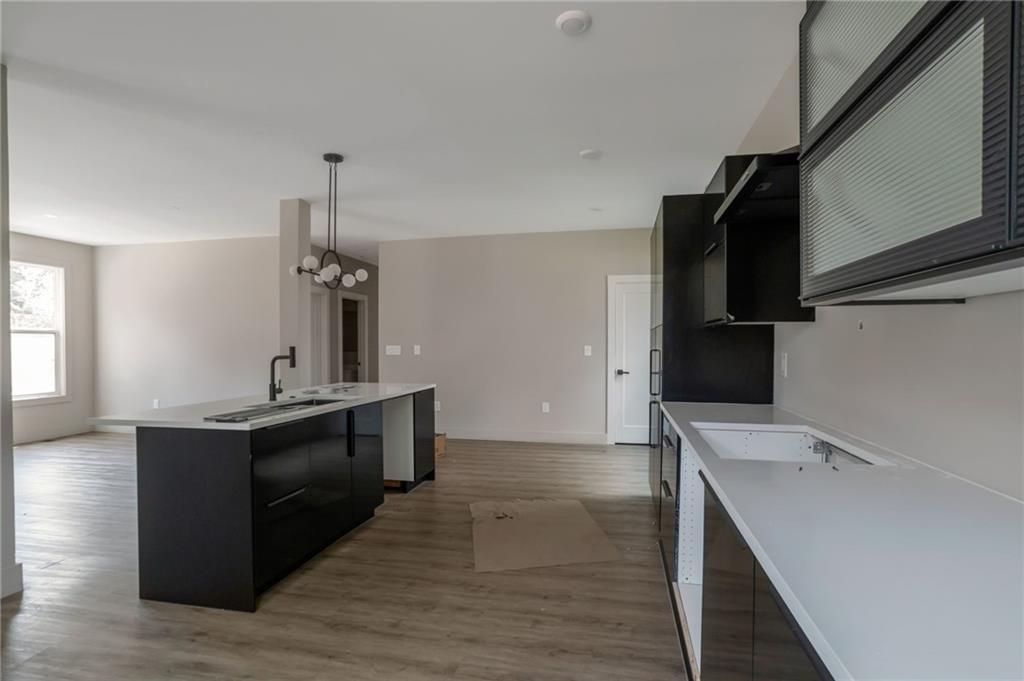 3139 Alston Drive Decatur, GA 30032 - Photo 11 of 40 a kitchen with a sink and wooden floor