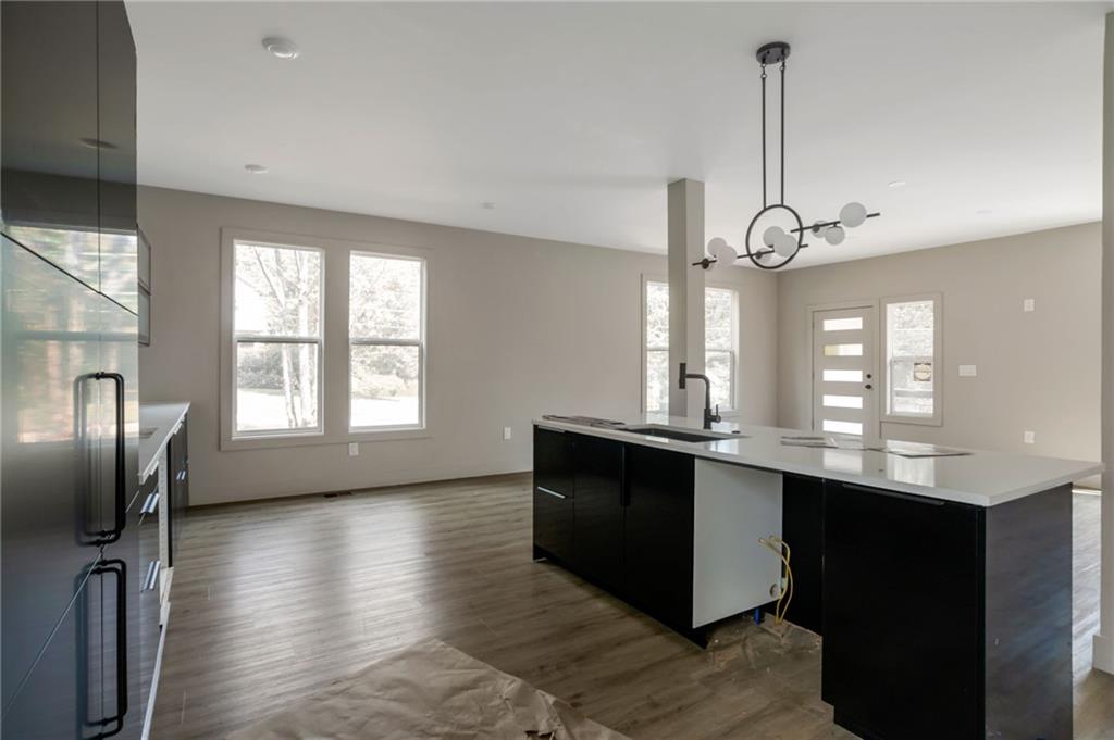 3139 Alston Drive Decatur, GA 30032 - Photo 13 of 40 a kitchen with stainless steel appliances granite countertop a sink a stove and a wooden floors