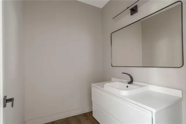 a bathroom with a sink and mirror
