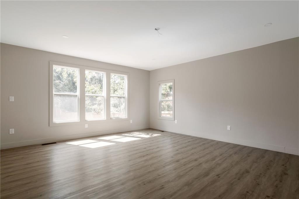3139 Alston Drive Decatur, GA 30032 - Photo 16 of 40 an empty room with wooden floor and windows