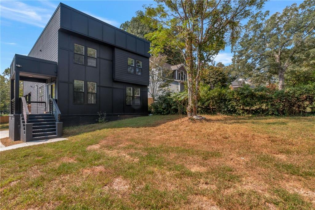 3139 Alston Drive Decatur, GA 30032 - Photo 2 of 40 a front view of a house with a yard