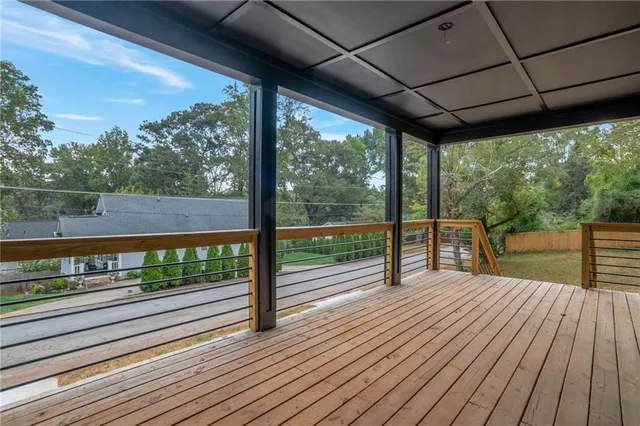 a view of porch with wooden floor