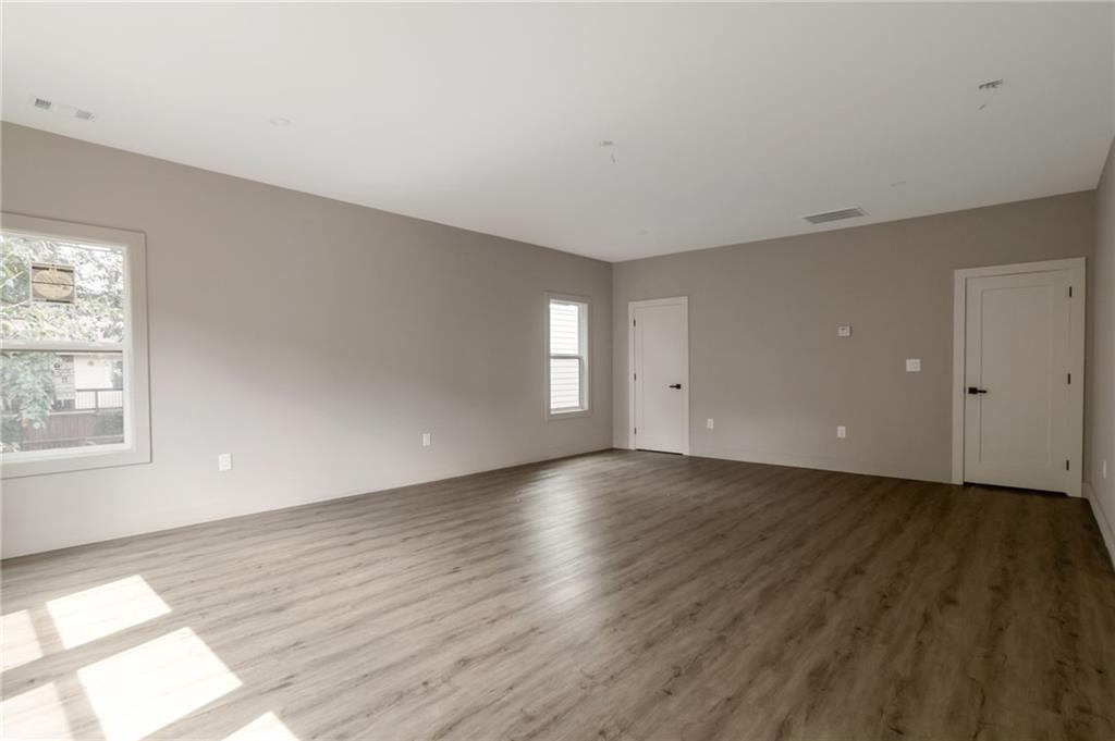 3139 Alston Drive Decatur, GA 30032 - Photo 25 of 40 an empty room with wooden floor and windows