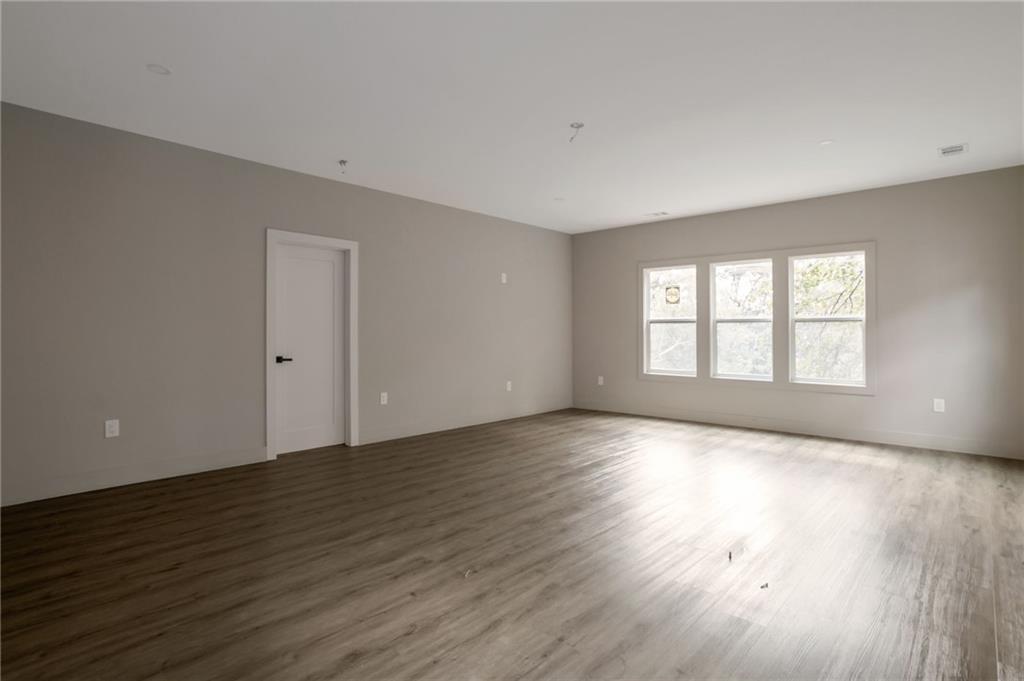 3139 Alston Drive Decatur, GA 30032 - Photo 27 of 40 a view of an empty room with wooden floor and a window
