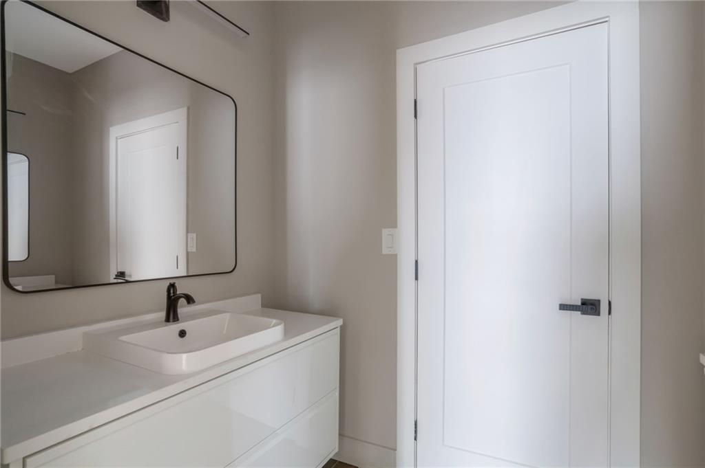 3139 Alston Drive Decatur, GA 30032 - Photo 32 of 40 a bathroom with a sink and mirror