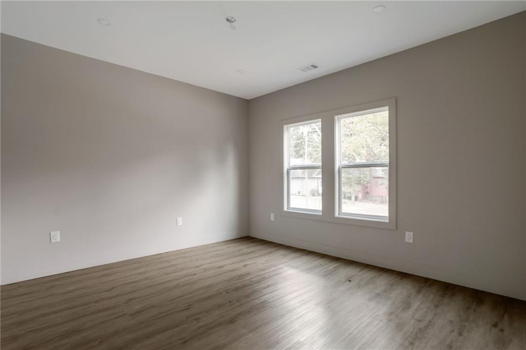 3139 Alston Drive Decatur, GA 30032 - Photo 37 of 40 an empty room with wooden floor and windows