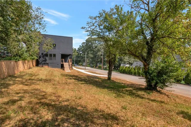 a view of a yard with a tree