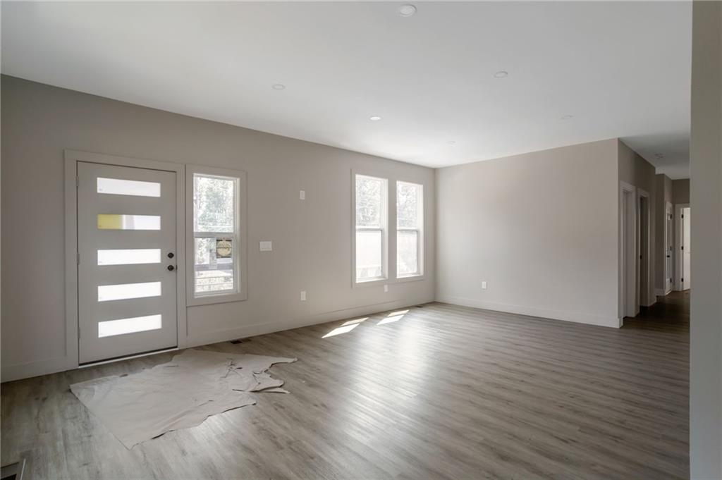 3139 Alston Drive Decatur, GA 30032 - Photo 7 of 40 an empty room with wooden floor and windows