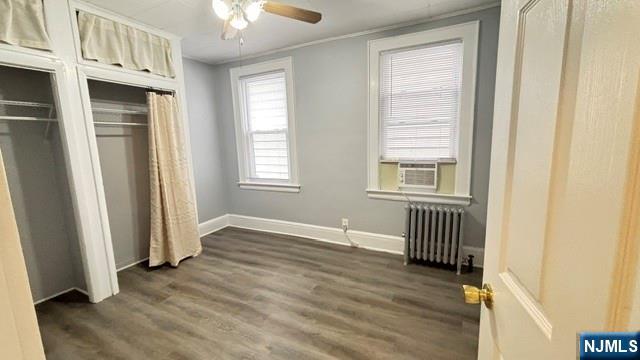 760 Hamilton Street, Unit 1 Harrison, NJ 07029 - Photo 8 of 23 an empty room with wooden floor and windows