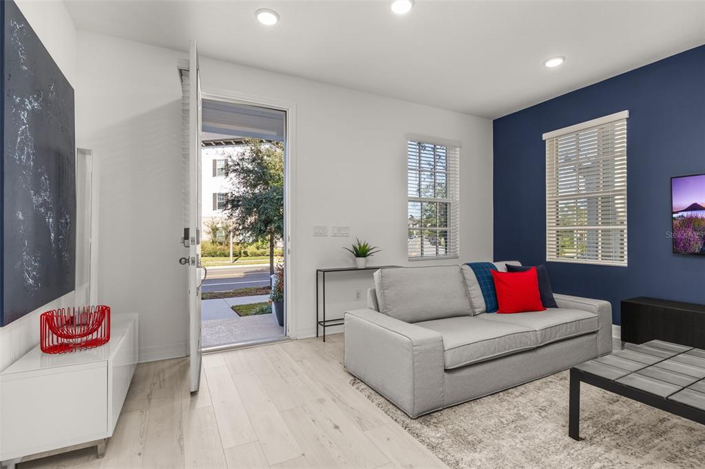 1849 Island Village Way Celebration, FL 34747 - Photo 16 of 50 a living room with furniture and a window
