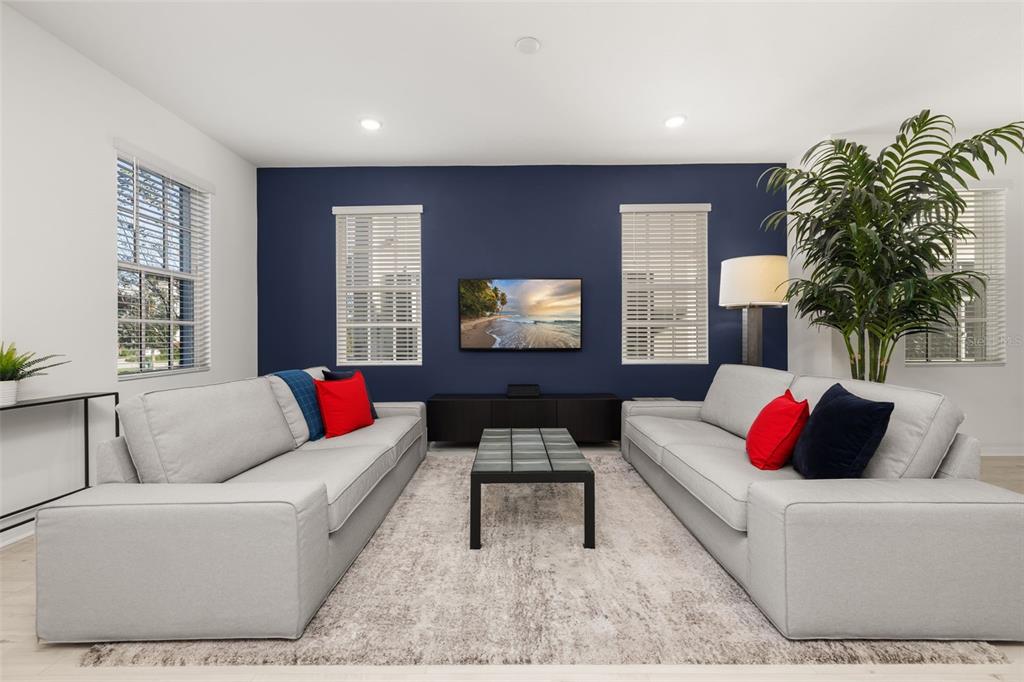 1849 Island Village Way Celebration, FL 34747 - Photo 19 of 50 a living room with furniture and a potted plant