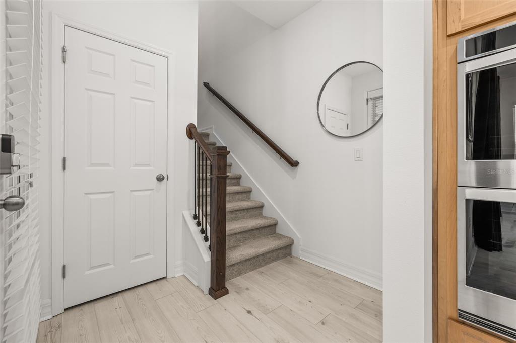 1849 Island Village Way Celebration, FL 34747 - Photo 22 of 50 a view of a livingroom with wooden floor and entryway