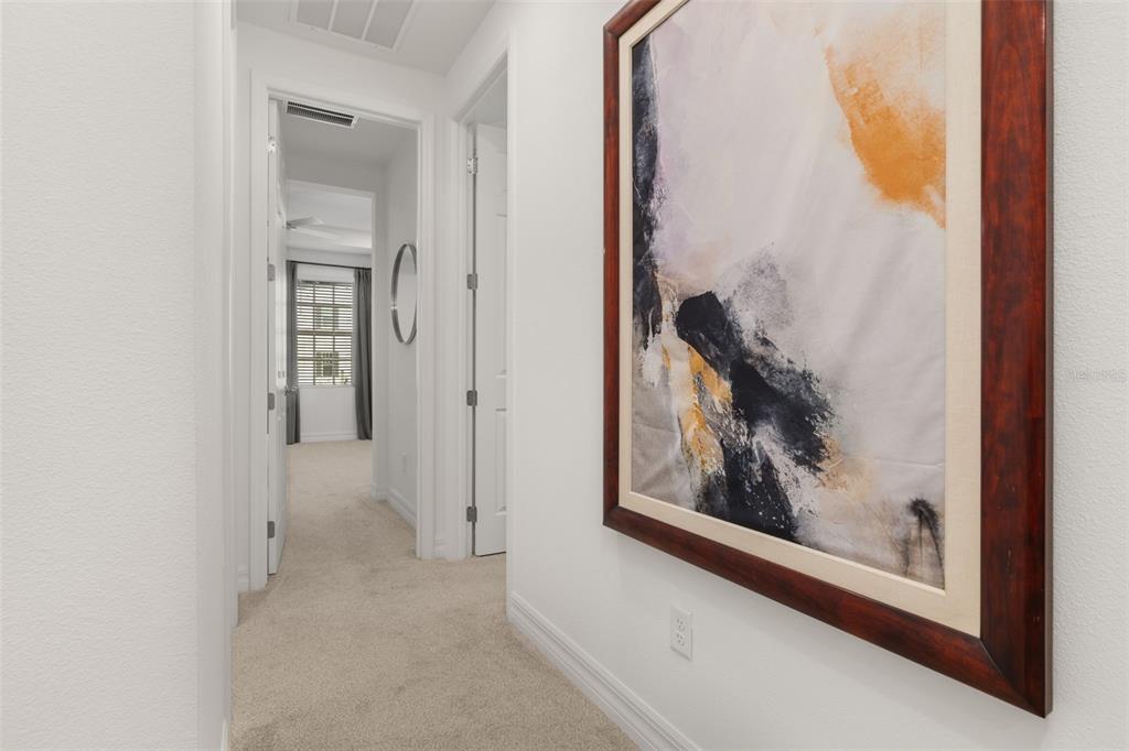 1849 Island Village Way Celebration, FL 34747 - Photo 24 of 50 a view of a hallway with a painting on the wall