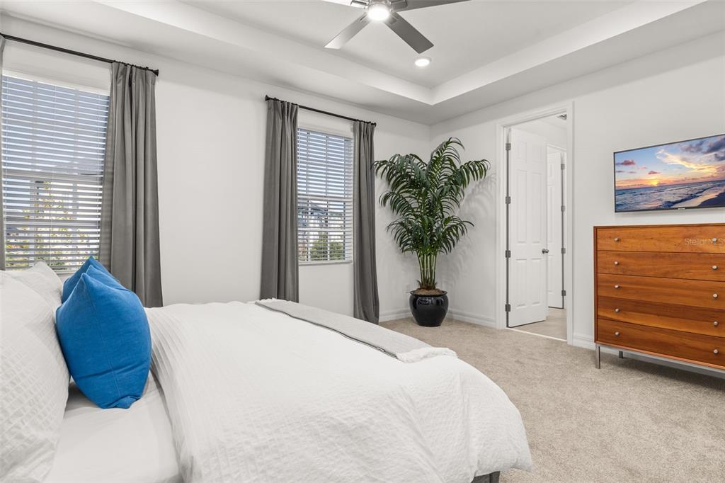 1849 Island Village Way Celebration, FL 34747 - Photo 27 of 50 a bedroom with a bed and a potted plant