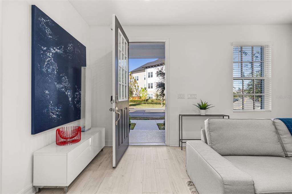 1849 Island Village Way Celebration, FL 34747 - Photo 3 of 50 a living room with furniture