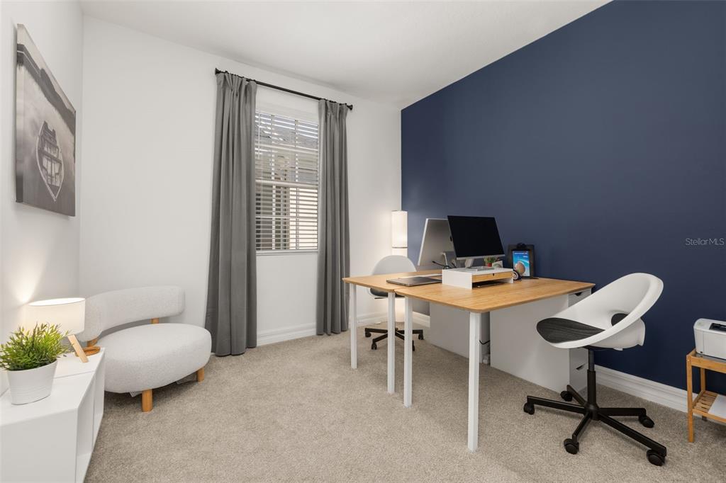 1849 Island Village Way Celebration, FL 34747 - Photo 36 of 50 a view of a workspace with furniture and a window