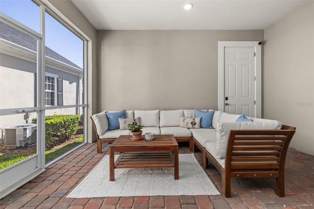 1849 Island Village Way Celebration, FL 34747 - Photo 6 of 50 a living room with furniture and a table