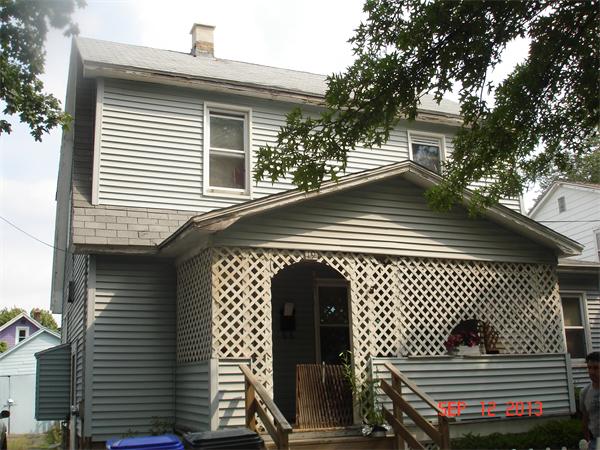 a front view of a house with garage